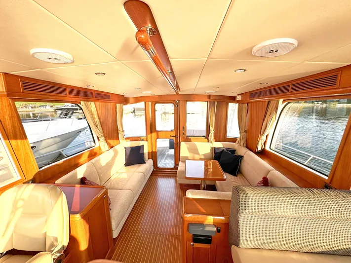 Phoenix Yacht Photos Pics Luxurious interior of 2014 Grand Banks 46 Eastbay FB yacht with elegant wood finishes.