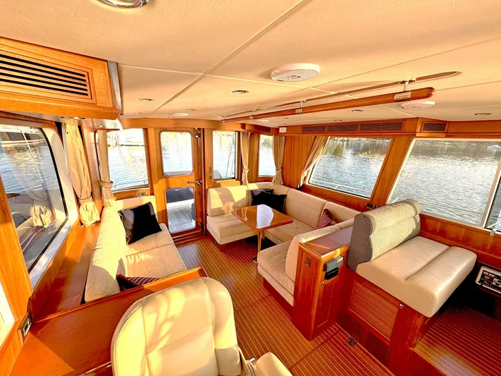 Phoenix Yacht Photos Pics Luxurious interior of 2014 Grand Banks 46 Eastbay FB yacht with elegant wood finishes.