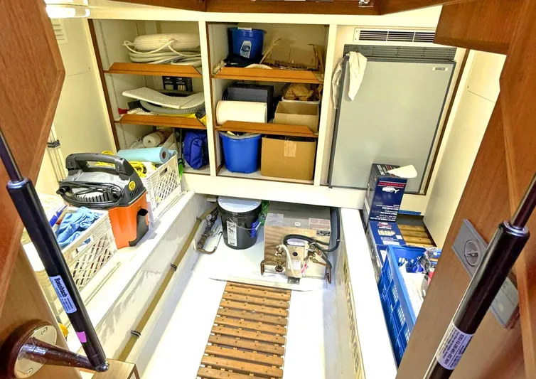 Phoenix Yacht Photos Pics Storage area in a 2014 Grand Banks 46 Eastbay FB, featuring shelves and equipment.