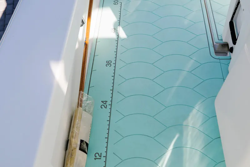  Yacht Photos Pics 2017 Albury Brothers center console boat with turquoise patterned deck and measuring scale.