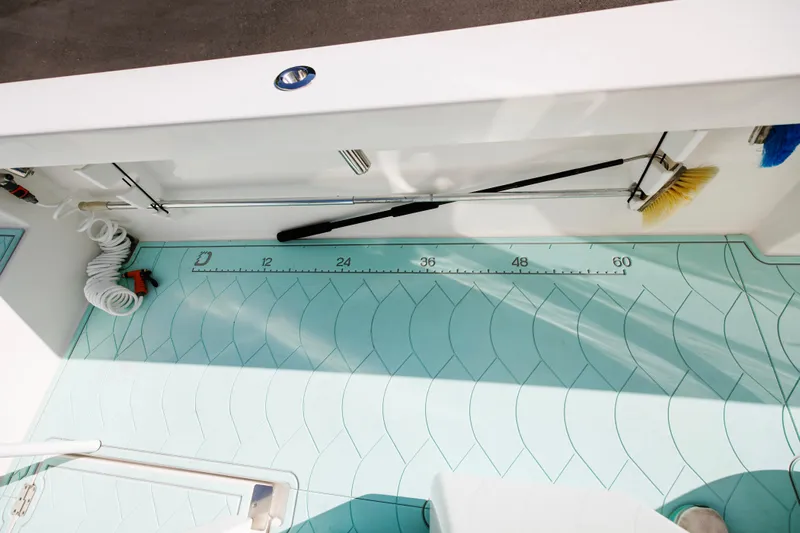  Yacht Photos Pics 2017 Albury Brothers center console boat deck with cleaning tools and measuring scale.