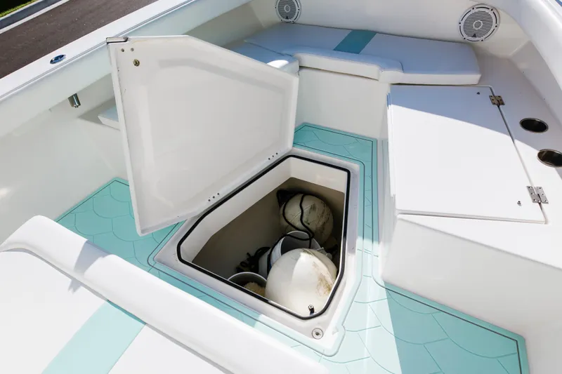  Yacht Photos Pics 2017 Albury Brothers center console boat with open storage compartment and teal flooring.