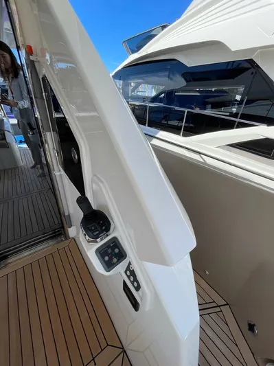  Yacht Photos Pics 2019 Absolute 62 Fly yacht with sleek design and modern controls on deck.
