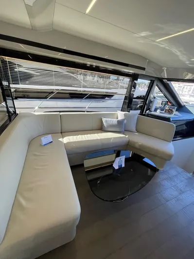  Yacht Photos Pics Luxurious interior of 2019 Absolute 62 Fly yacht with elegant seating and modern design.