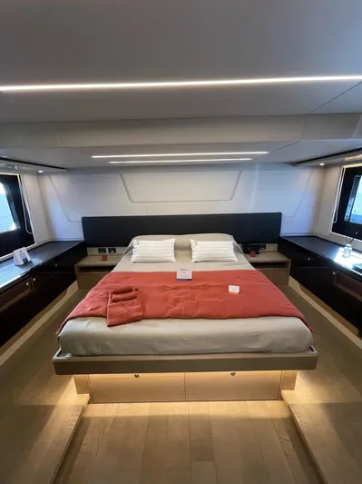  Yacht Photos Pics Luxurious bedroom interior of 2019 Absolute 62 Fly yacht with modern design and ambient lighting.