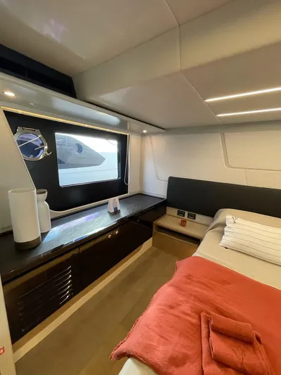  Yacht Photos Pics Luxurious interior of a 2019 Absolute 62 Fly yacht cabin with modern furnishings.