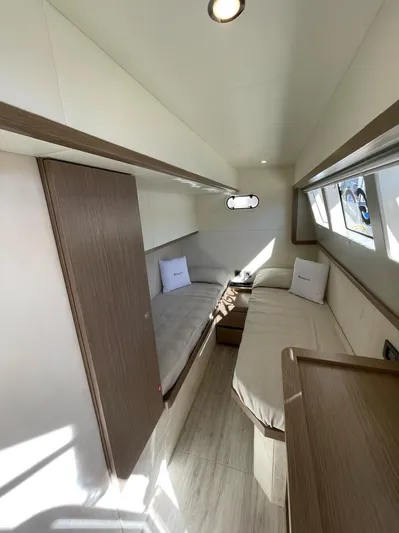  Yacht Photos Pics Interior of 2019 Absolute 62 Fly yacht with modern twin beds and natural light.