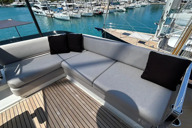  Yacht Photos Pics Luxurious seating on 2022 Prestige X60 yacht with marina view.