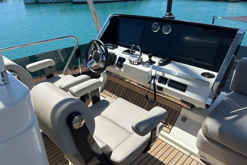  Yacht Photos Pics Luxurious 2022 Prestige X60 yacht helm with modern controls and comfortable seating.