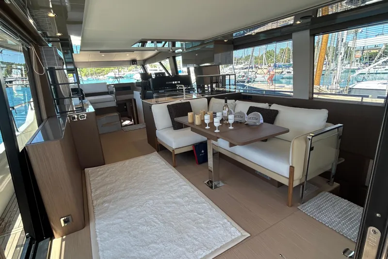  Yacht Photos Pics Luxurious interior of 2022 Prestige X60 yacht with elegant seating and dining area.