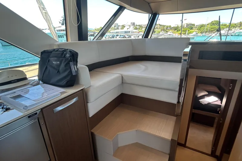  Yacht Photos Pics Luxurious interior of 2022 Prestige X60 yacht with seating and cabin view.