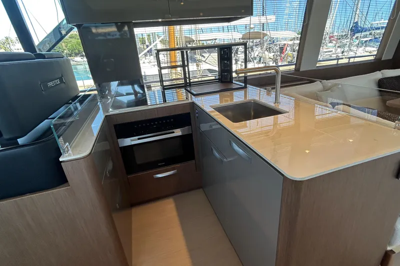  Yacht Photos Pics Modern kitchen interior of 2022 Prestige X60 yacht with sleek countertops and appliances.