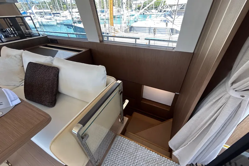  Yacht Photos Pics Luxurious interior of 2022 Prestige X60 yacht with elegant seating and staircase.