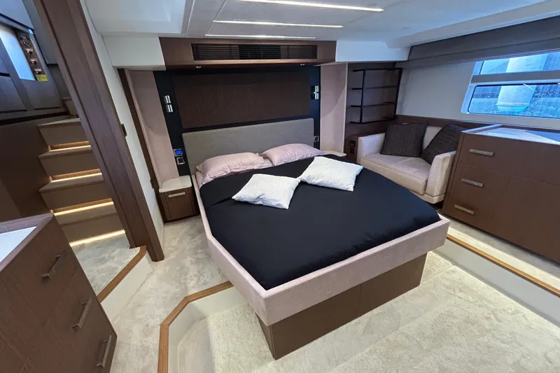  Yacht Photos Pics Luxurious bedroom interior of 2022 Prestige X60 yacht with modern furnishings and elegant design.
