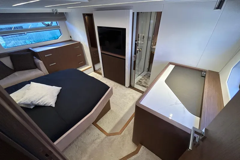  Yacht Photos Pics Luxurious 2022 Prestige X60 yacht interior with modern bedroom and sleek design.
