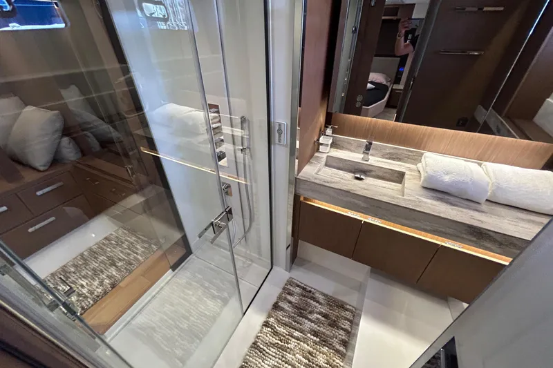  Yacht Photos Pics Luxurious bathroom in 2022 Prestige X60 yacht with modern fixtures and elegant design.