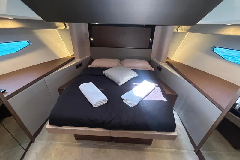  Yacht Photos Pics Luxurious bedroom interior of 2022 Prestige X60 yacht with modern design and ocean view.