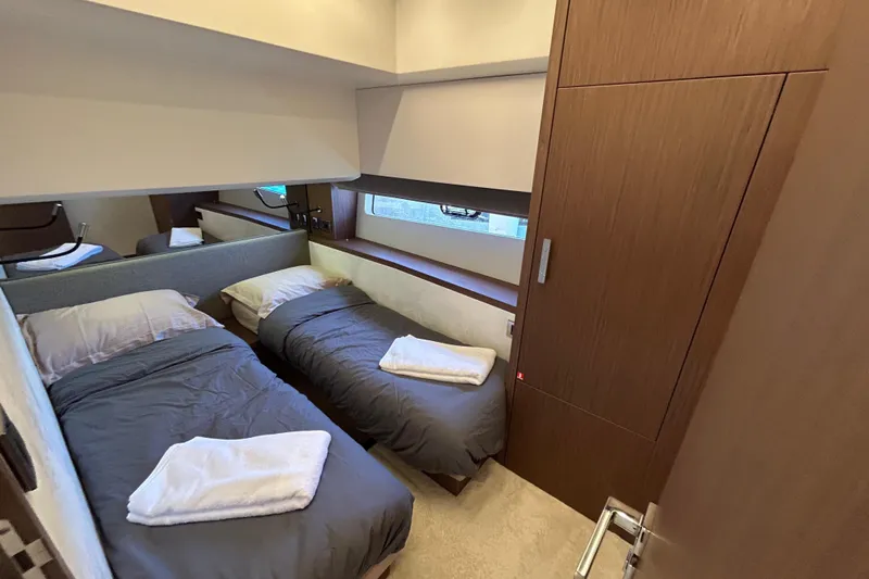  Yacht Photos Pics Luxurious twin cabin in 2022 Prestige X60 yacht with modern wood finishes.