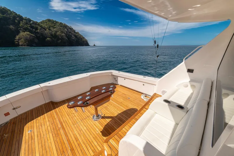 Game On Yacht Photos Pics 2025 Viking 58 Convertible yacht deck with ocean view and seating area.