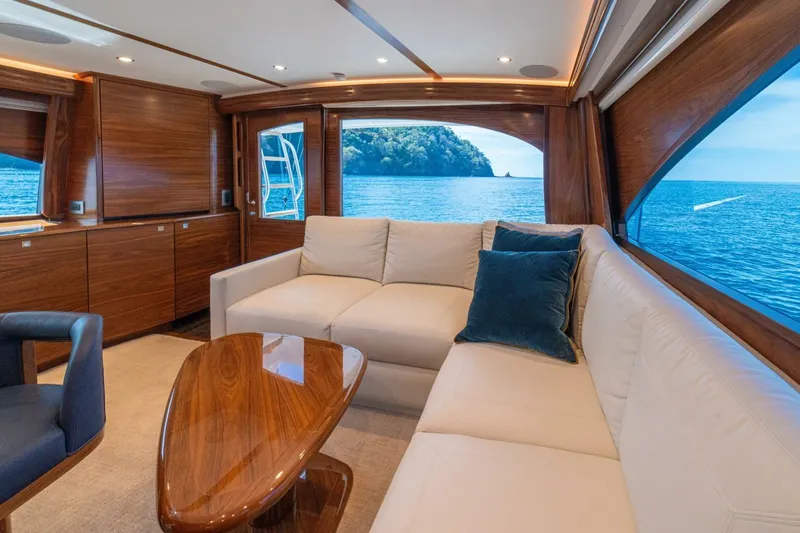 Game On Yacht Photos Pics Luxurious interior of 2025 Viking 58 Convertible yacht with ocean view.