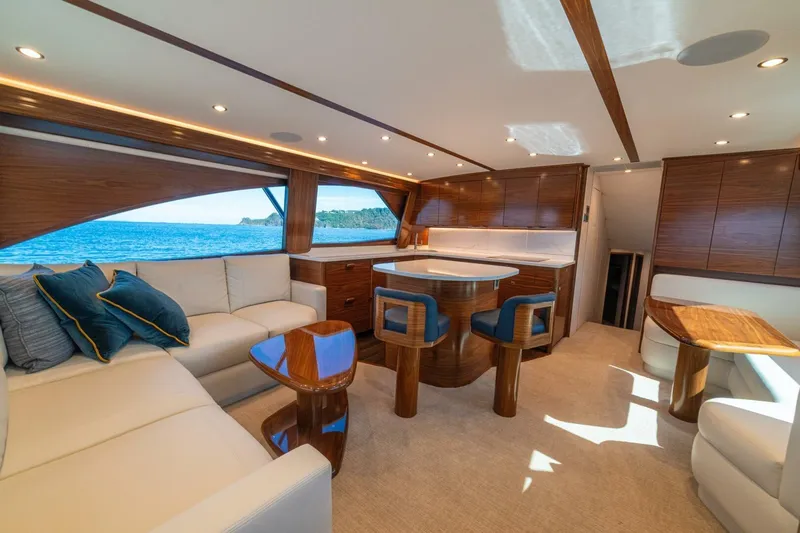 Game On Yacht Photos Pics Luxurious interior of 2025 Viking 58 Convertible yacht with elegant wood finishes.