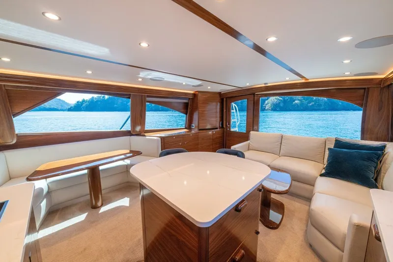 Game On Yacht Photos Pics Luxurious interior of 2025 Viking 58 Convertible yacht with elegant wood and plush seating.