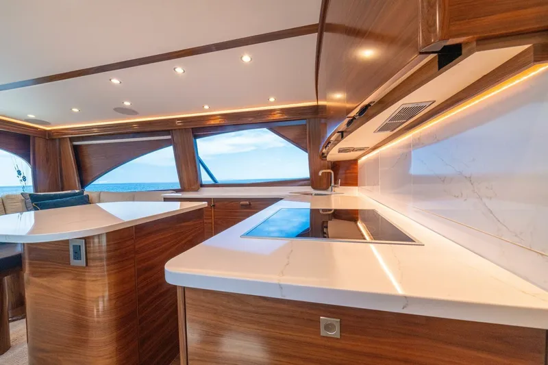 Game On Yacht Photos Pics Luxurious interior of 2025 Viking 58 Convertible yacht with modern kitchen design.