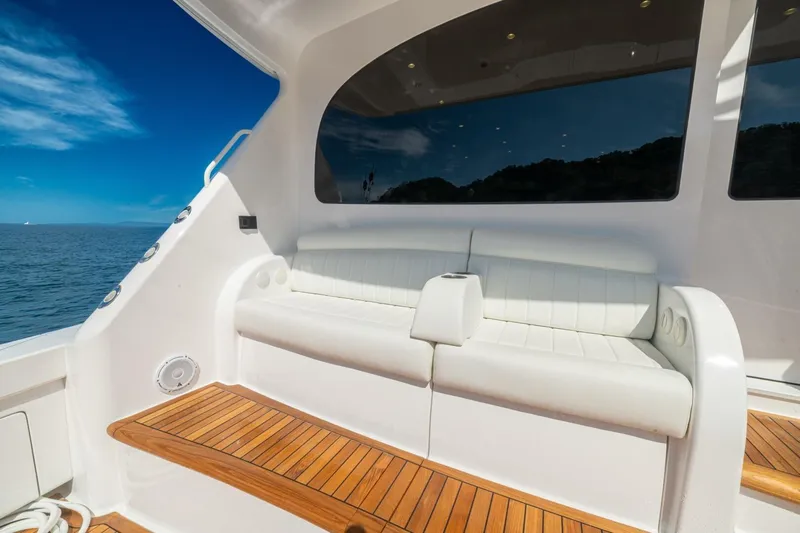 Game On Yacht Photos Pics Luxurious seating on 2025 Viking 58 Convertible yacht with ocean view.