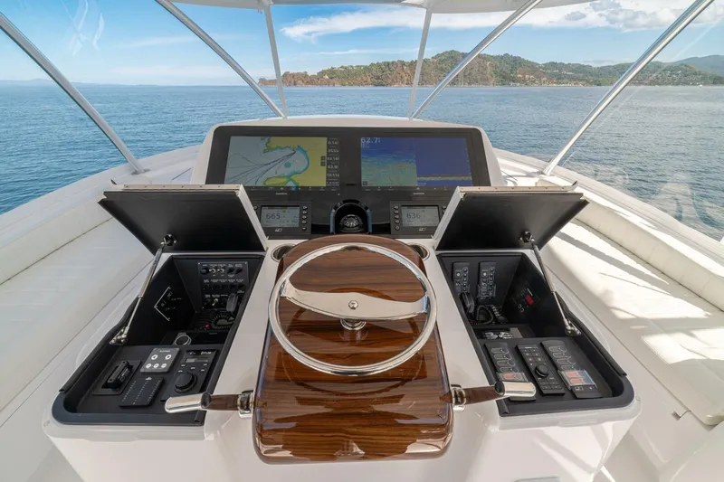 Game On Yacht Photos Pics 2025 Viking 58 Convertible yacht helm with advanced navigation systems and ocean view.