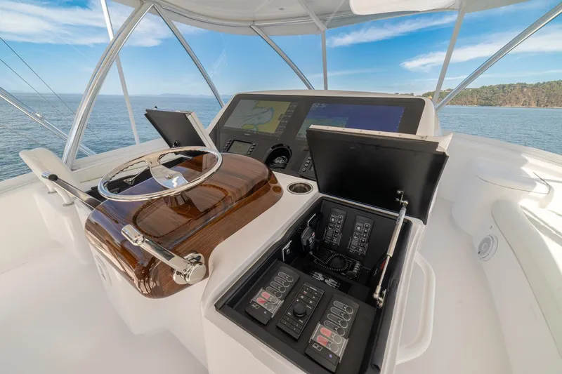 Game On Yacht Photos Pics 2025 Viking 58 Convertible yacht helm with advanced navigation controls and ocean view.