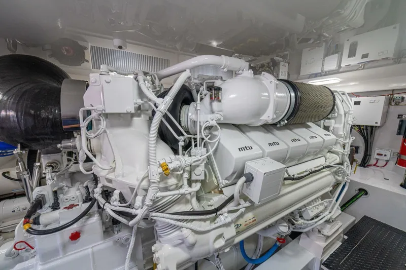 Game On Yacht Photos Pics Engine room of 2025 Viking 58 Convertible yacht with MTU engine components.