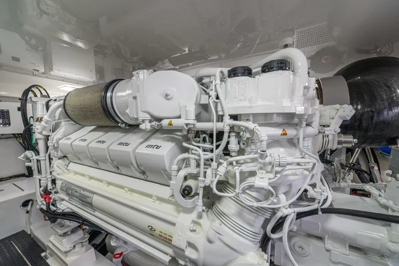 Game On Yacht Photos Pics Engine room of 2025 Viking 58 Convertible yacht, featuring advanced MTU engine components.