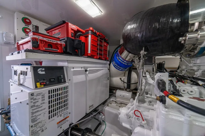 Game On Yacht Photos Pics Engine room of 2025 Viking 58 Convertible yacht with Cummins generator and toolboxes.