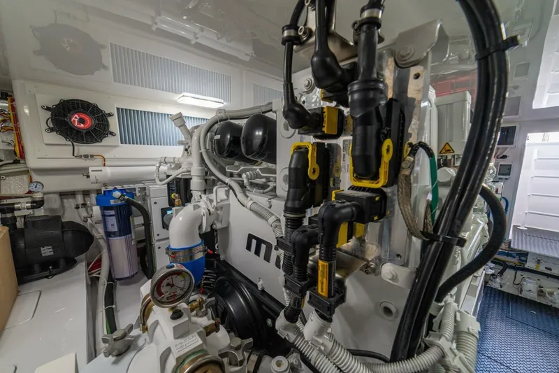 Game On Yacht Photos Pics Engine room of 2025 Viking 58 Convertible yacht, showcasing advanced machinery and components.