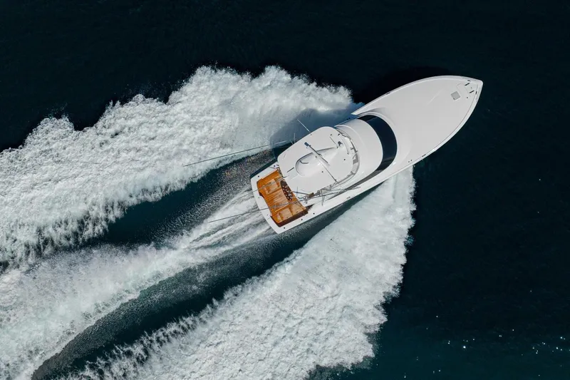 Game On Yacht Photos Pics Aerial view of 2025 Viking 58 Convertible yacht cruising on open water.