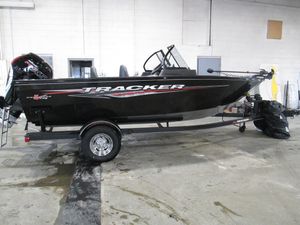 2023 Tracker Pro Guide V-175 WT fishing boat in a showroom.