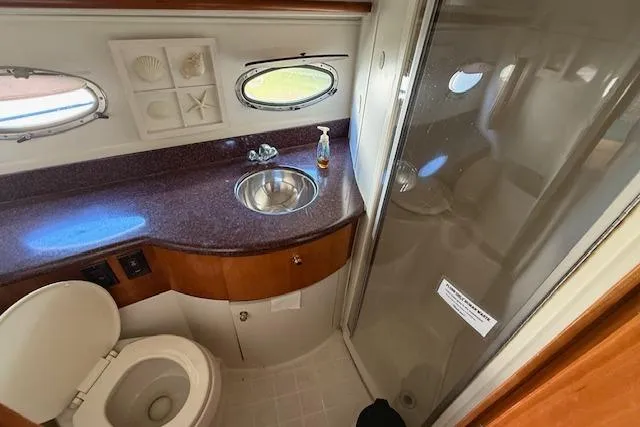 Yacht Photos Pics 2001 Carver 396 Aft Cabin Motor Yacht bathroom with sink, toilet, and shower.