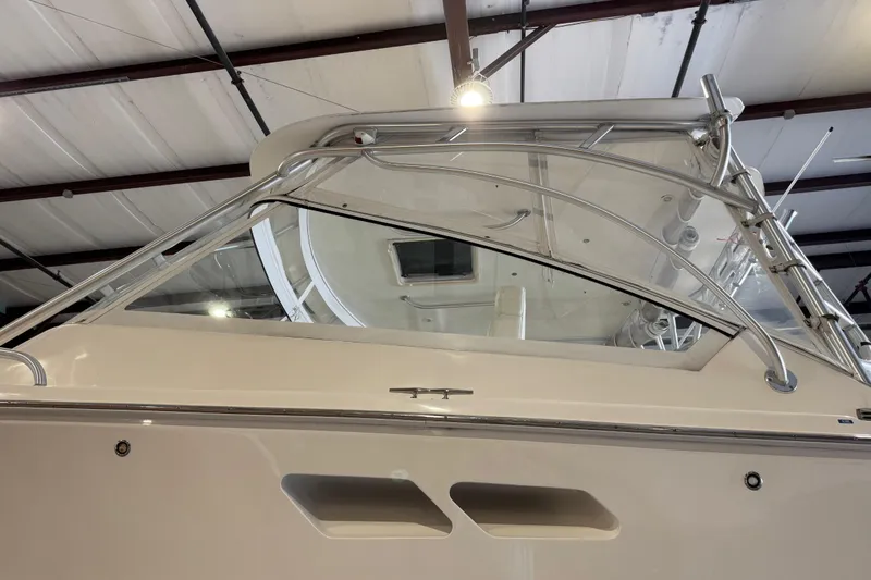 Chasin Tail Yacht Photos Pics 2011 Luhrs 30 Open boat in a warehouse, showcasing sleek design and sturdy construction.