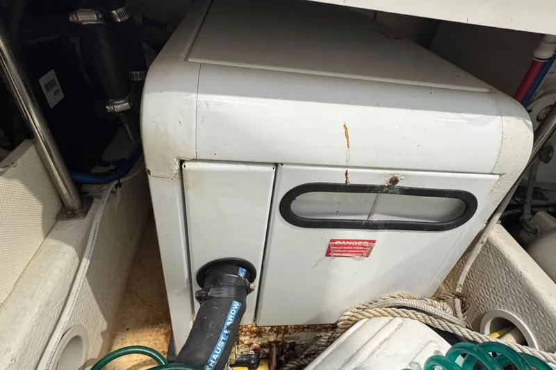 Chasin Tail Yacht Photos Pics Engine compartment of 2011 Luhrs 30 Open boat with visible machinery and hoses.