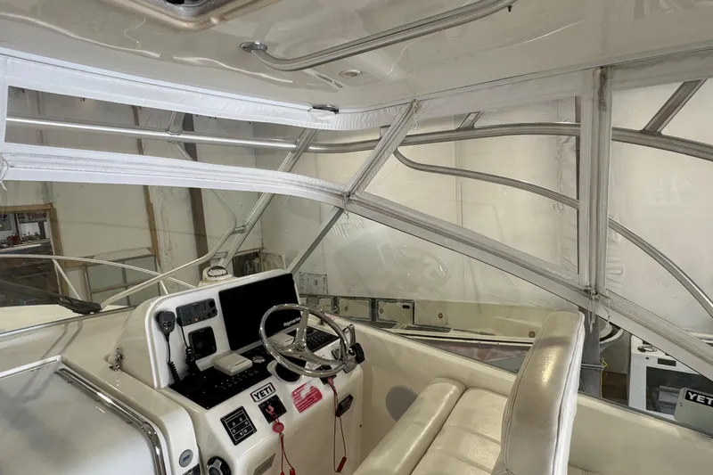 Chasin Tail Yacht Photos Pics 2011 Luhrs 30 Open boat interior with steering wheel and navigation equipment.