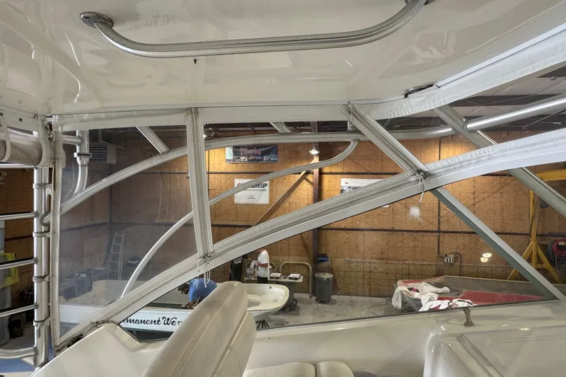 Chasin Tail Yacht Photos Pics Interior view of a 2011 Luhrs 30 Open boat in a workshop setting.