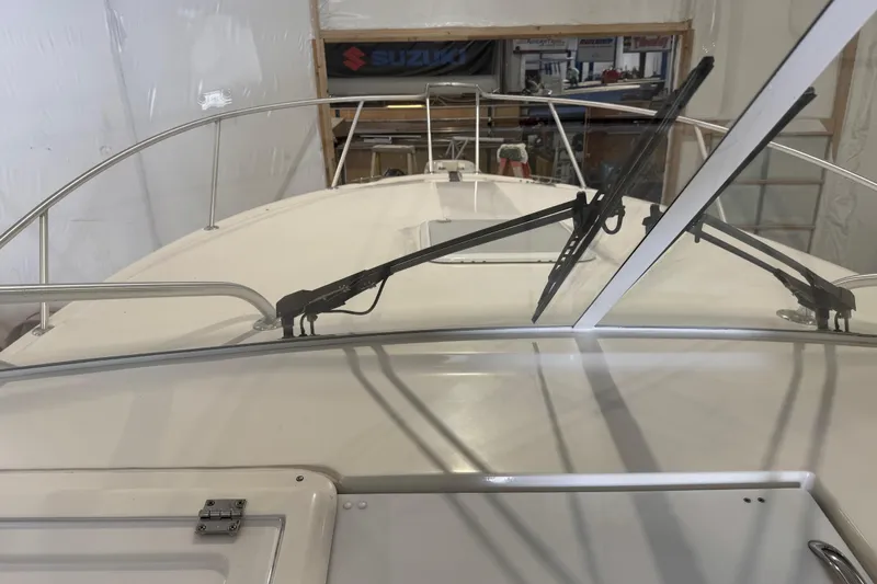 Chasin Tail Yacht Photos Pics 2011 Luhrs 30 Open boat windshield and deck view in a workshop setting.