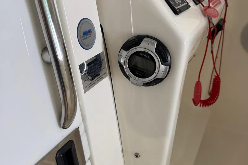 Chasin Tail Yacht Photos Pics 2011 Luhrs 30 Open boat dashboard with Sony stereo and safety warnings.