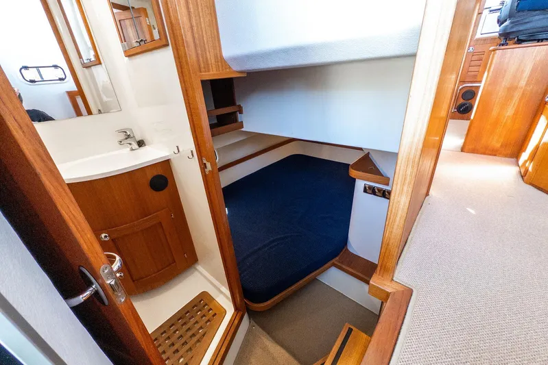  Yacht Photos Pics Interior of 2019 Targa 32 boat featuring a compact cabin and bathroom.