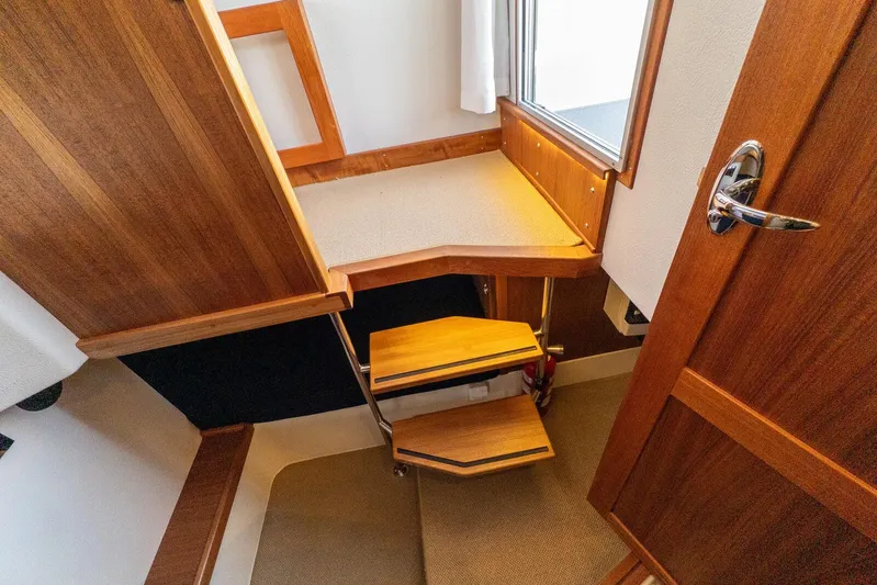  Yacht Photos Pics Interior of 2019 Targa 32 boat with wooden stairs and door.