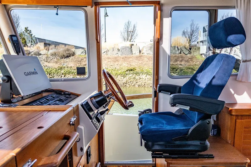  Yacht Photos Pics Interior of 2019 Targa 32 boat with Garmin navigation system and blue captain's chair.