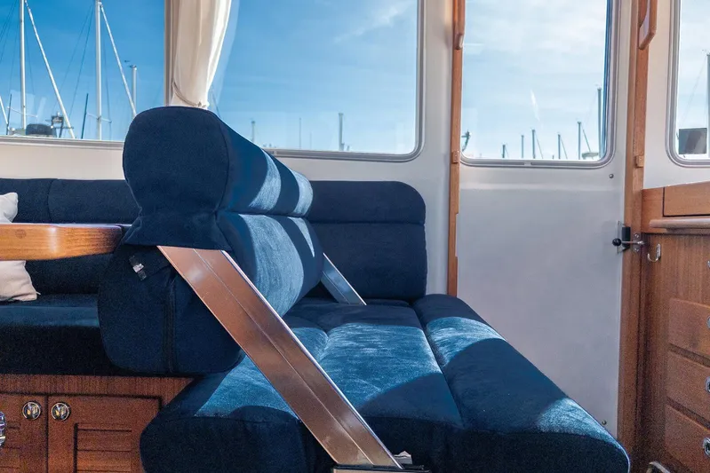  Yacht Photos Pics Interior of 2019 Targa 32 boat with blue seating and wooden accents.