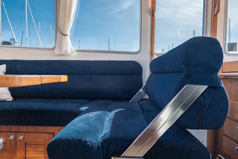  Yacht Photos Pics Interior of 2019 Targa 32 boat with blue seating and wooden table.