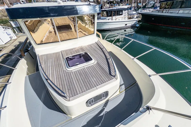  Yacht Photos Pics 2019 Targa 32 boat with sleek deck design, docked in a marina.