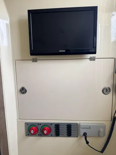  Yacht Photos Pics Control panel of a 2020 Chris-Craft Catalina 30 with a screen and Garmin device.